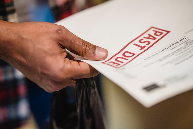 man holding paper with 