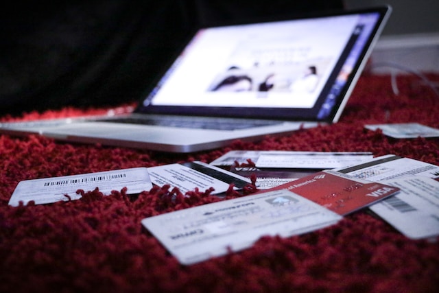 credit cards next to laptop