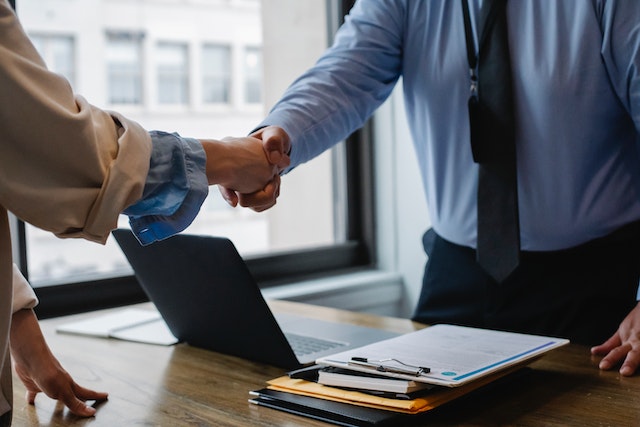 two people shaking hands