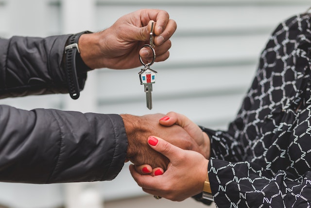 people holding hands and keys