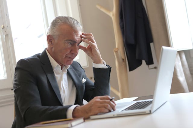 stressed man at computer