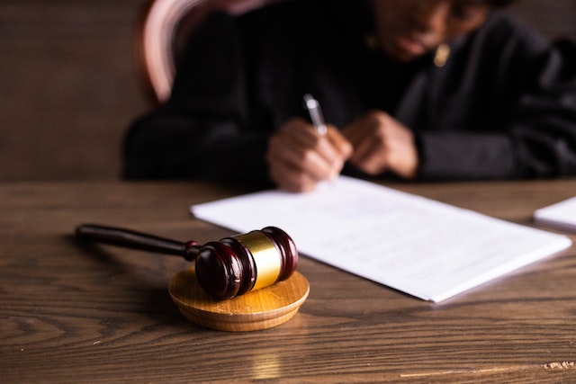 judge signing paper
