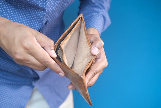 man opening empty wallet